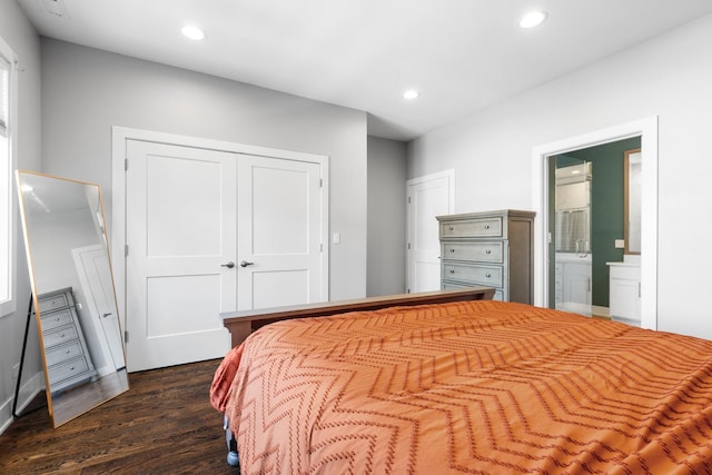 bedroom with recessed lighting, a closet, connected bathroom, and dark wood-style floors