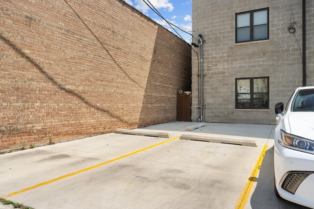 exterior space featuring brick siding