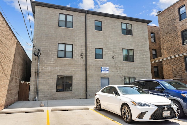 view of property with uncovered parking