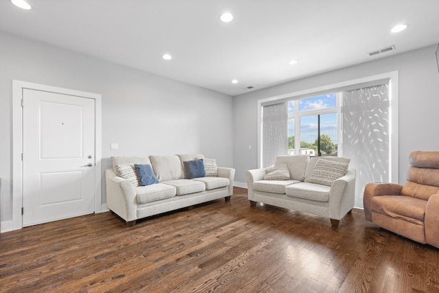 living room with dark wood finished floors, recessed lighting, visible vents, and baseboards