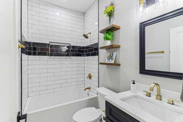 bathroom with washtub / shower combination, vanity, and toilet