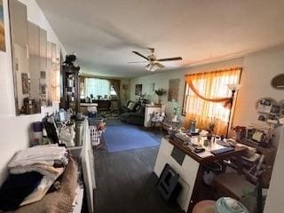 interior space with ceiling fan and dark wood-type flooring