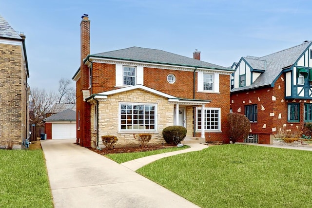 view of front of home featuring an outbuilding, brick siding, a chimney, a front yard, and stone siding