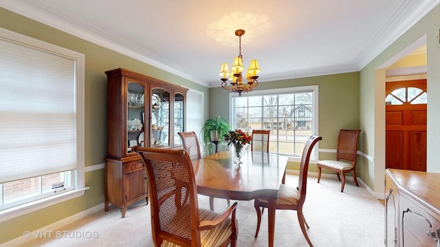 dining space with a chandelier, light colored carpet, crown molding, and baseboards