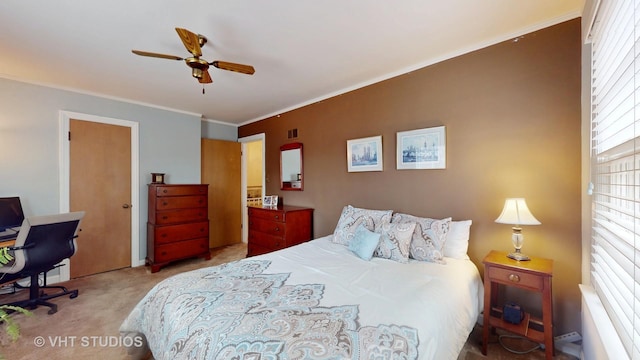 bedroom featuring crown molding, ceiling fan, and carpet flooring