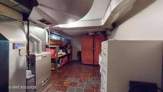 unfinished basement featuring visible vents