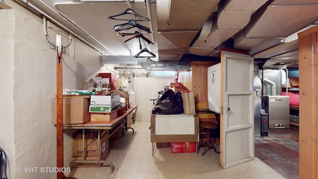 unfinished below grade area featuring electric panel and tile patterned floors