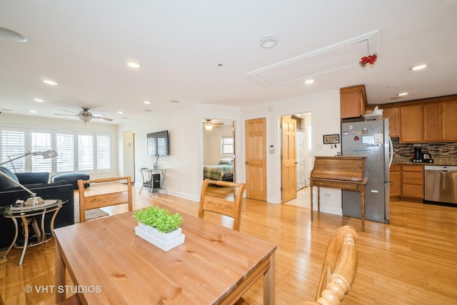 dining space featuring a ceiling fan, attic access, recessed lighting, and light wood-style floors