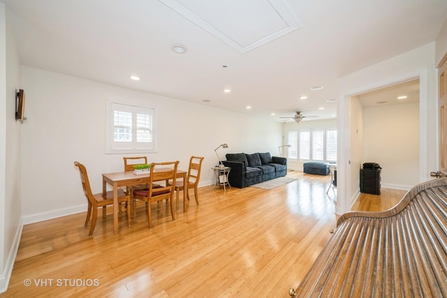 dining space with recessed lighting, baseboards, and light wood finished floors