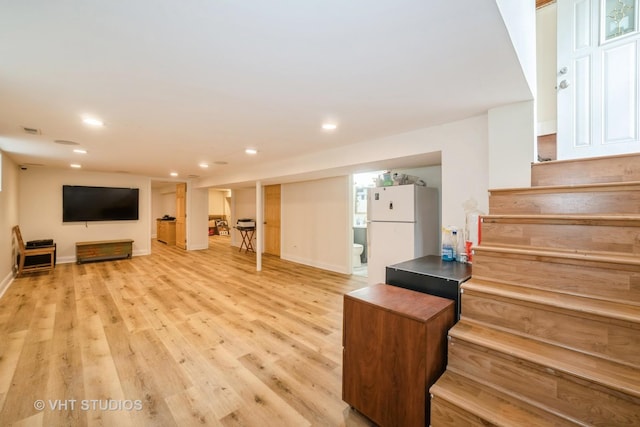 living area with light wood finished floors, stairway, recessed lighting, and visible vents