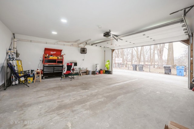 garage featuring a workshop area and a garage door opener