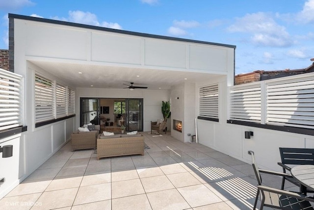 view of patio featuring outdoor lounge area and ceiling fan