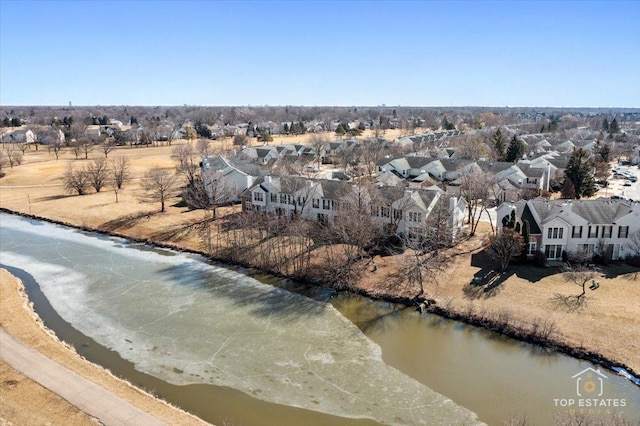 drone / aerial view featuring a residential view and a water view