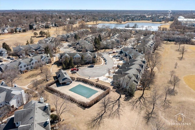 birds eye view of property with a water view and a residential view