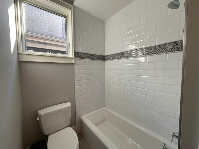 full bathroom featuring bathtub / shower combination and toilet