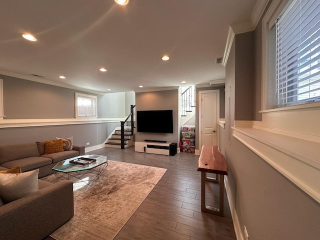 living area featuring dark wood-style floors, recessed lighting, ornamental molding, baseboards, and stairs