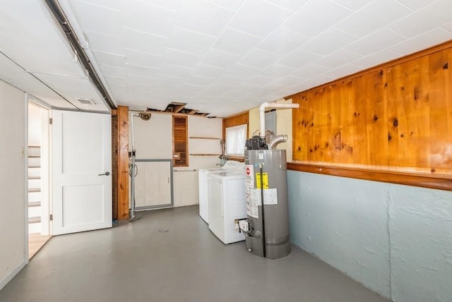 basement with separate washer and dryer and electric water heater