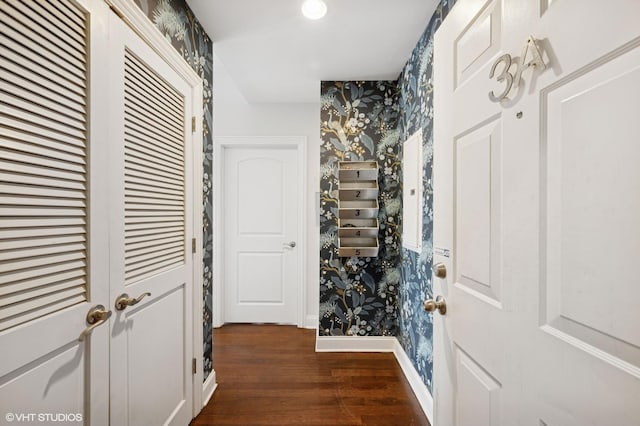 foyer featuring wallpapered walls, dark wood-style floors, and recessed lighting