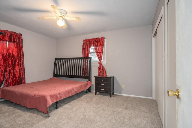 bedroom with carpet floors, baseboards, and a ceiling fan