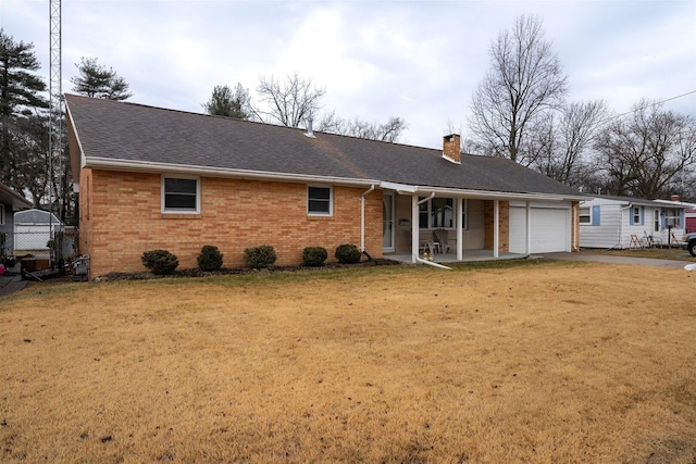 single story home with brick siding, driveway, a chimney, and an attached garage