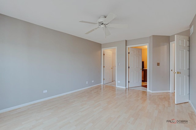 unfurnished bedroom featuring light wood-style flooring, baseboards, and a ceiling fan