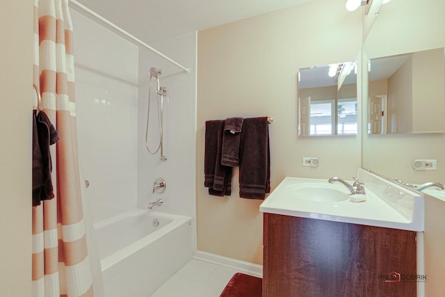 full bath featuring baseboards, vanity, and shower / bathtub combination with curtain