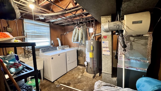 laundry area featuring laundry area, gas water heater, and washer and dryer