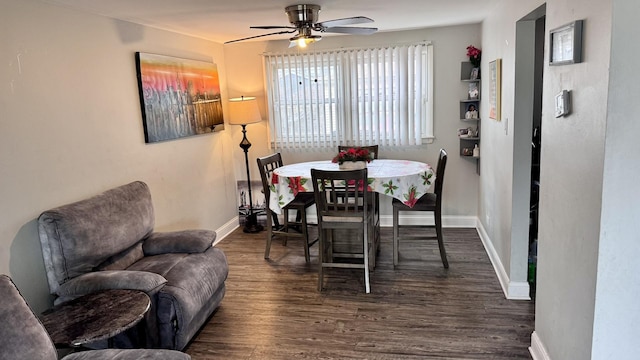 dining room with ceiling fan, baseboards, and wood finished floors