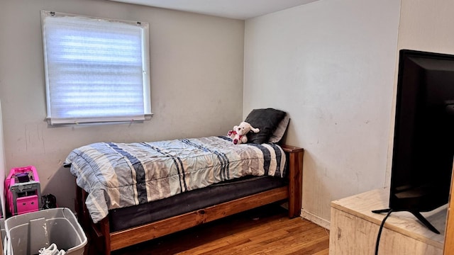 bedroom featuring wood finished floors