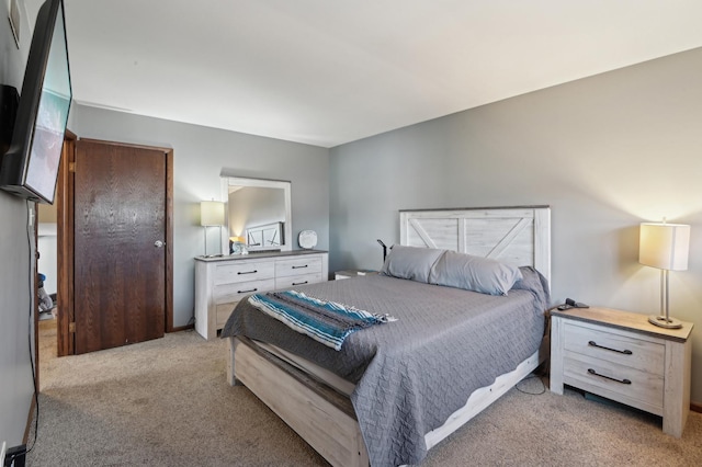 bedroom with light colored carpet