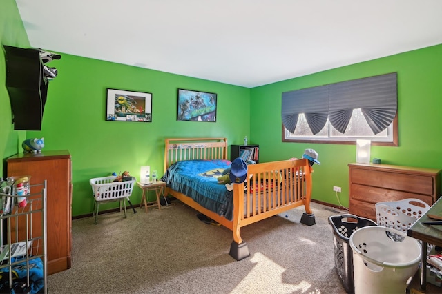 carpeted bedroom with baseboards