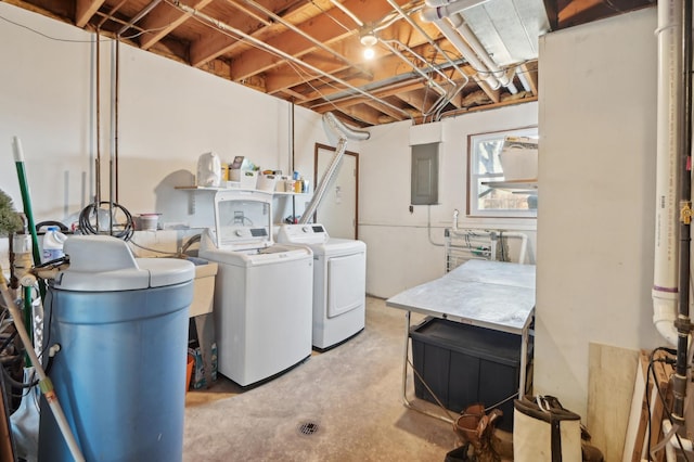 washroom featuring washer and dryer, electric panel, and laundry area