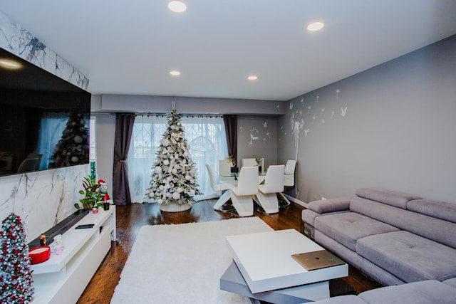 living room with wood finished floors and recessed lighting