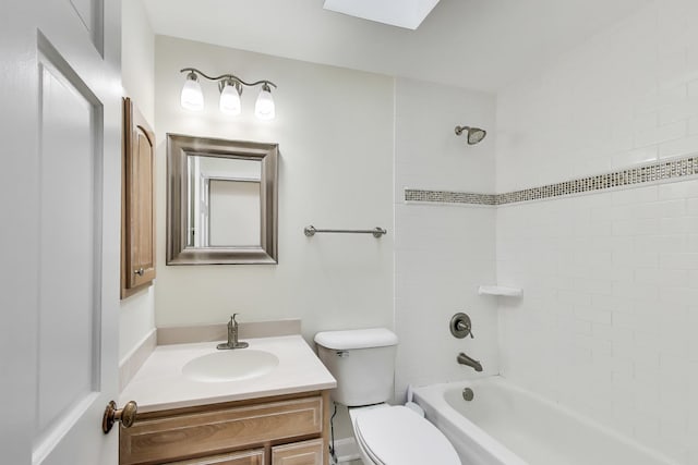 full bathroom with a skylight, vanity, toilet, and  shower combination