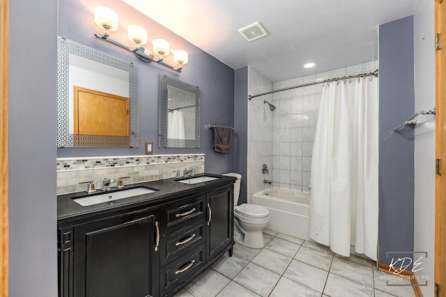 full bath featuring tasteful backsplash, tile patterned flooring, visible vents, and a sink