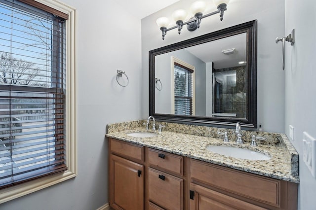 bathroom featuring double vanity and a sink