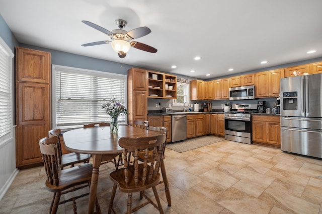 kitchen featuring recessed lighting, a ceiling fan, appliances with stainless steel finishes, open shelves, and dark countertops