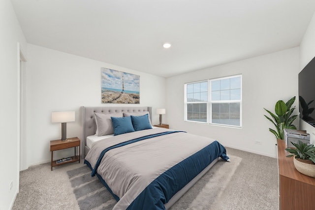 bedroom with carpet and baseboards