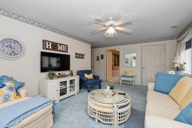 carpeted living room with a ceiling fan and visible vents