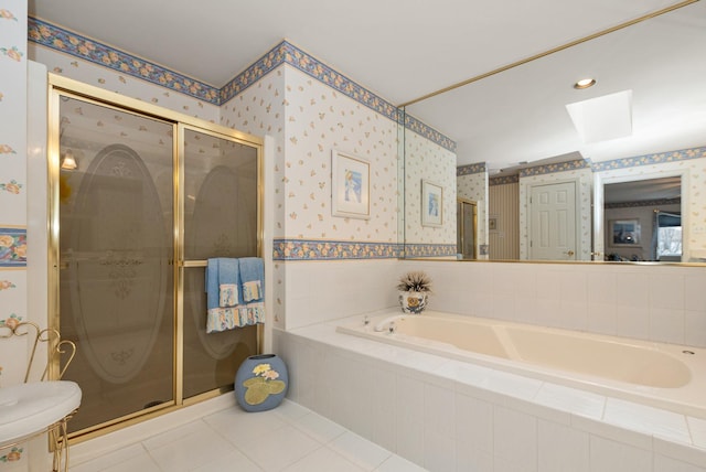 full bath featuring a skylight, a garden tub, a shower stall, and wallpapered walls