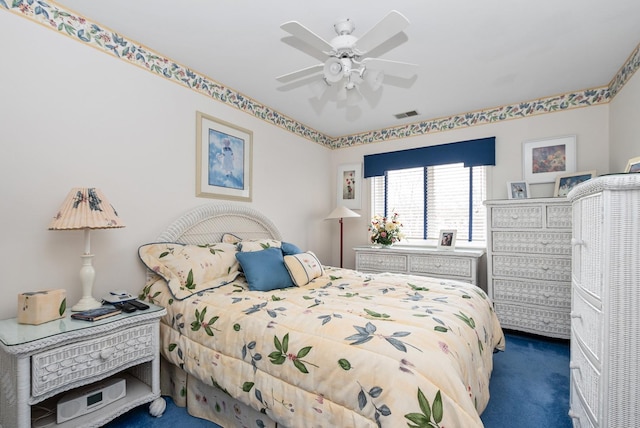 bedroom featuring carpet floors, visible vents, and a ceiling fan