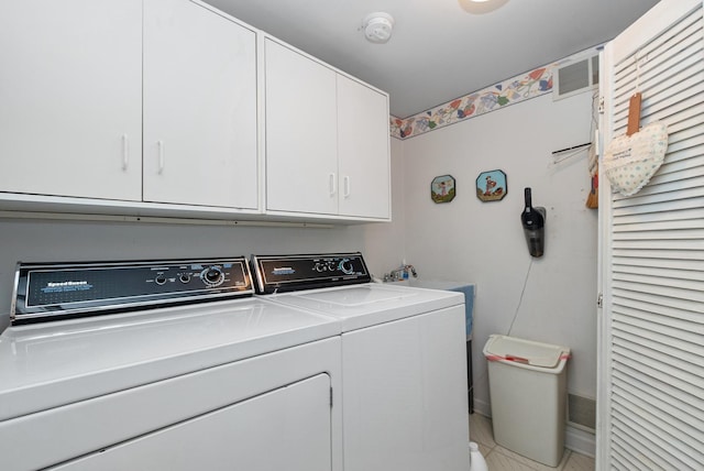 laundry room featuring cabinet space, independent washer and dryer, and visible vents