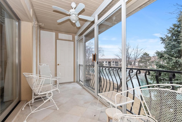 balcony featuring ceiling fan