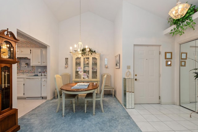 dining room featuring high vaulted ceiling, a notable chandelier, and light tile patterned floors