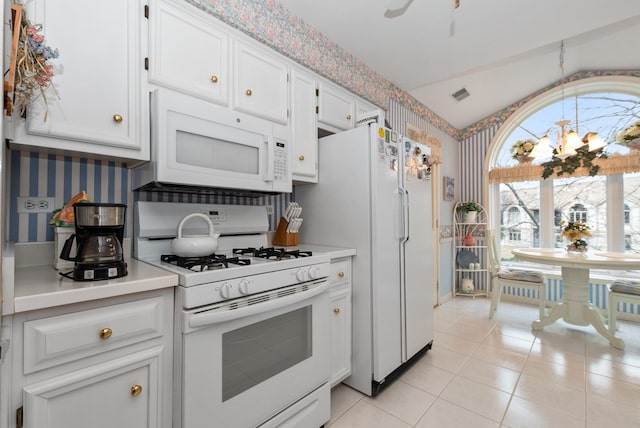 kitchen featuring white cabinets, white appliances, visible vents, and wallpapered walls