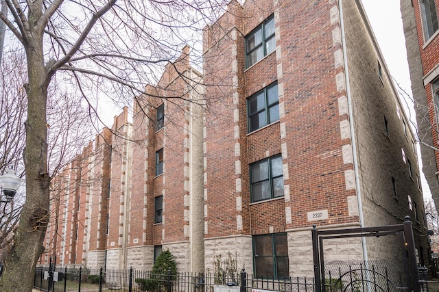 view of building exterior featuring fence