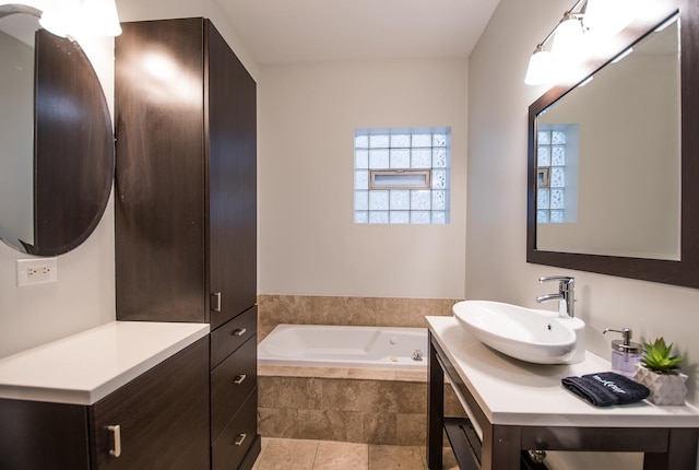 bathroom with vanity and a garden tub