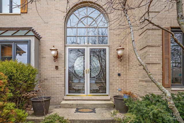 doorway to property with french doors and brick siding