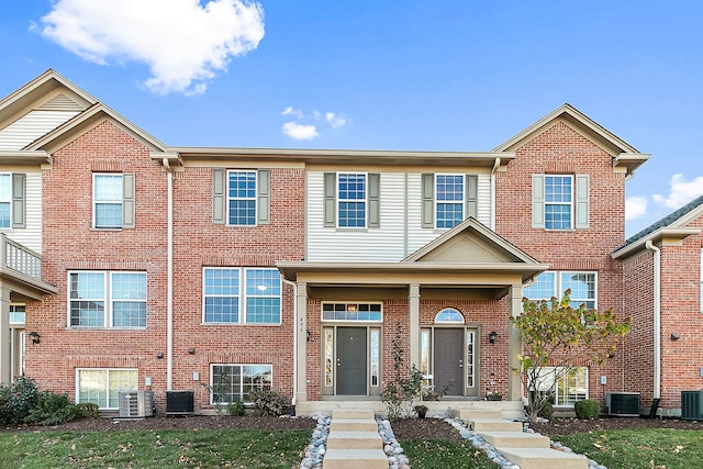 multi unit property featuring brick siding and cooling unit