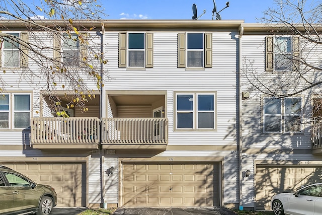 townhome / multi-family property with an attached garage